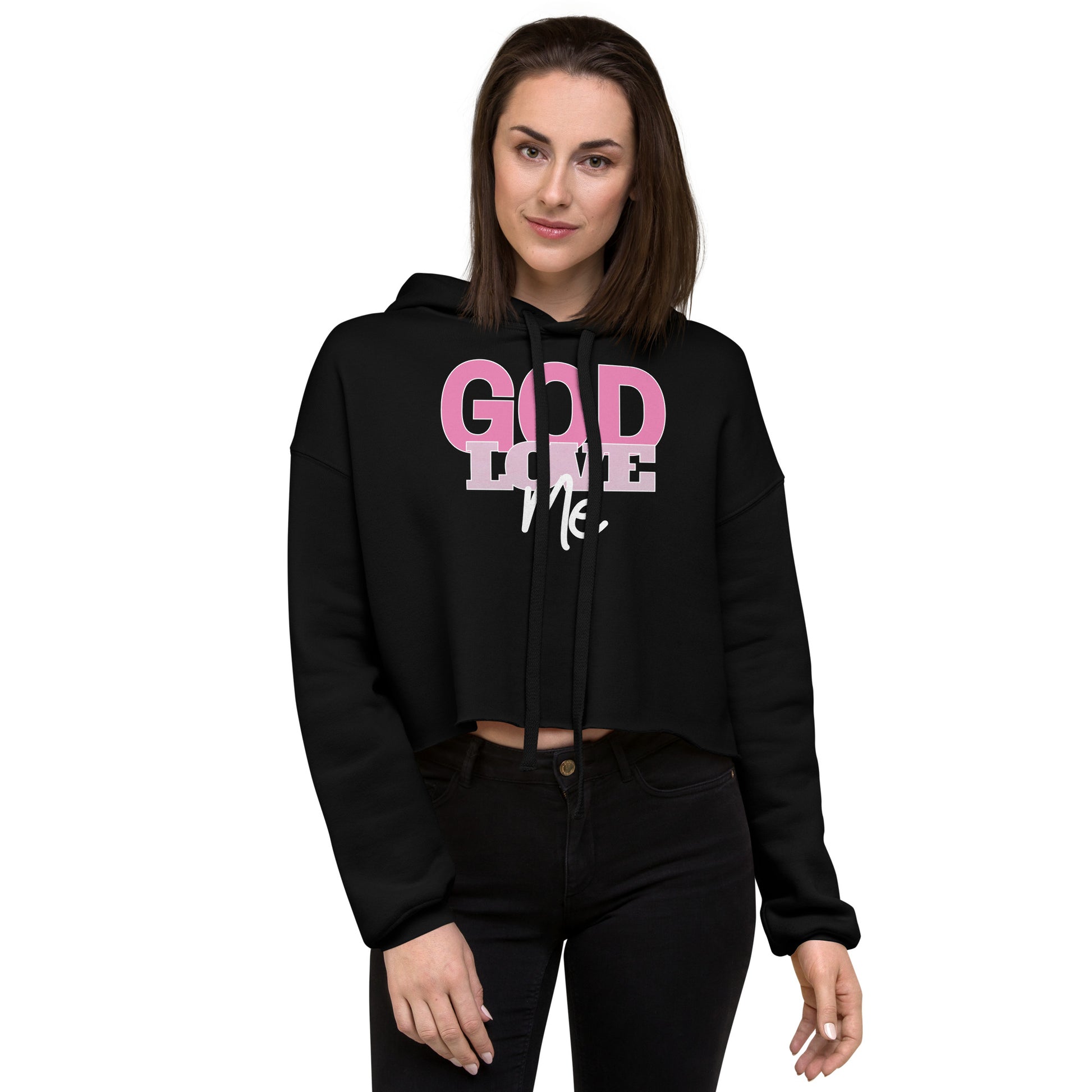 Woman wearing a black hoodie with pink and white text on a white background