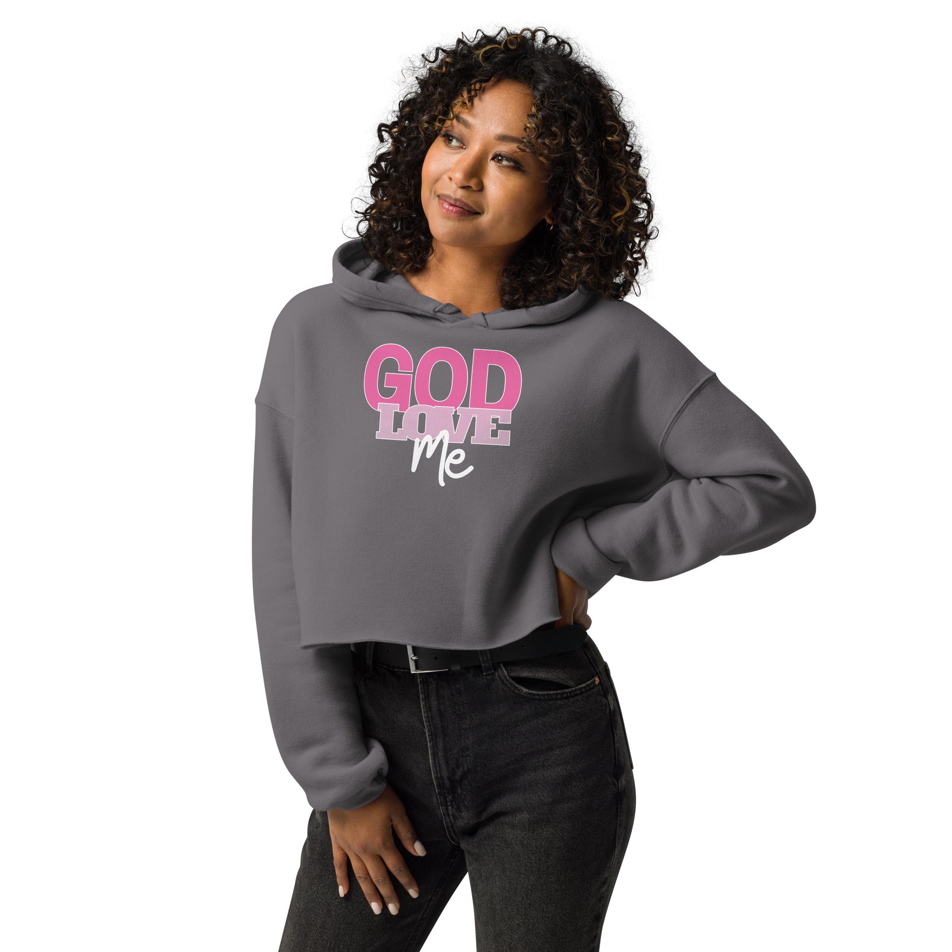 Woman wearing a gray hoodie with 'God Loves Me' text on a white background